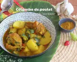 Un plat de colombo de poulet savoureux, avec des pommes de terre, des courgettes et des épices, prêt à être dégusté.